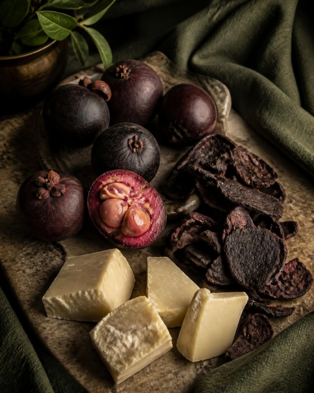 Kokum fruit cut open beside raw kokum butter